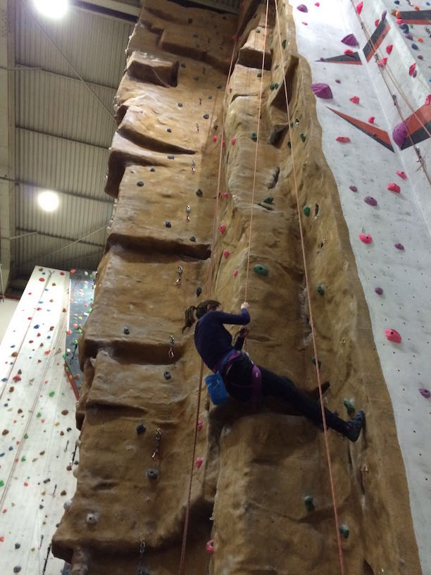 Woman on a climbing wall