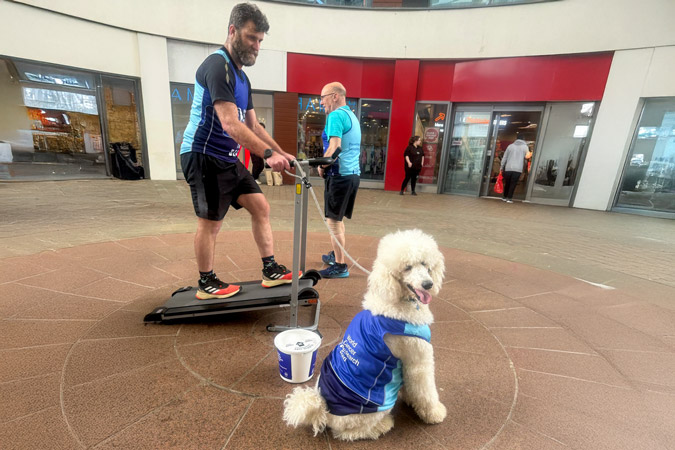 James Radford with his dog on a treadmill