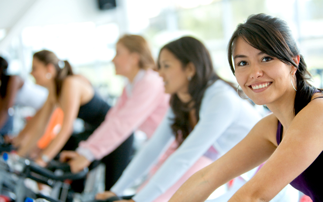 People on exercise bikes