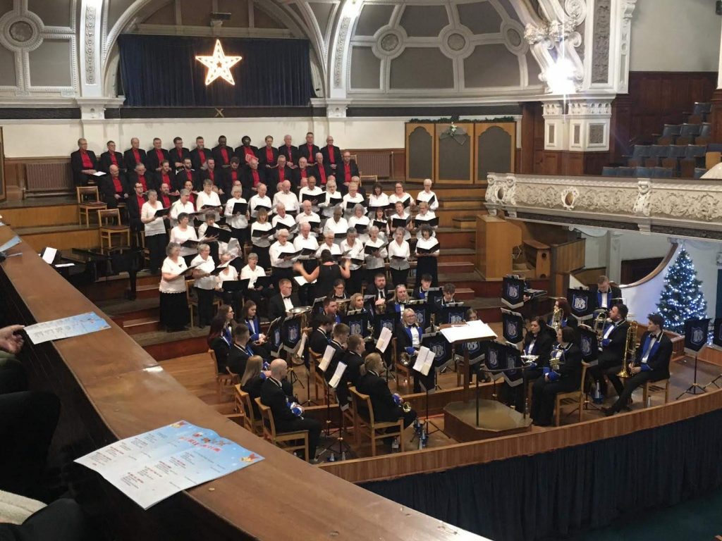 Bolton Cancer Voices at their annual Jingle Bell Sing-A-Long concert in the Victoria Hall, Bolton, in 2019