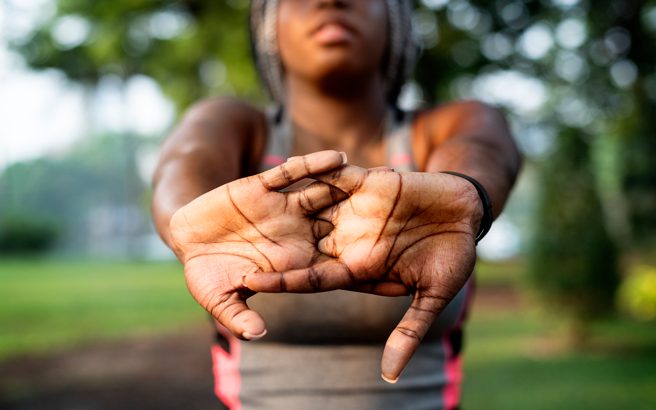 A woman stretching out her fingers