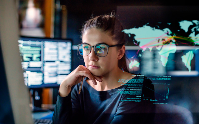 A young woman looking at a screen