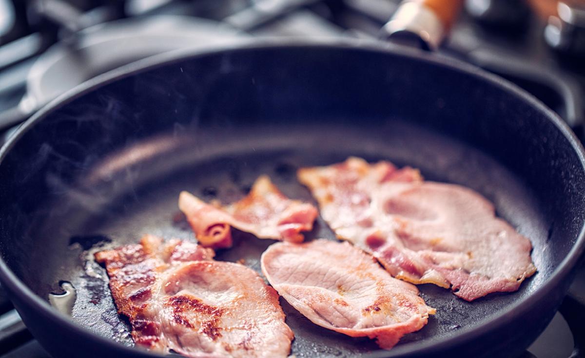Bacon frying in a pan