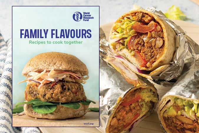 A cookbook cover titled Family Flavours: Recipes to cook together with a veggie burger, next to three foil-wrapped burritos filled with seasoned beans, lettuce, and vegetables, sliced to show the fillings.