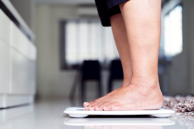 Feet on weighing scales