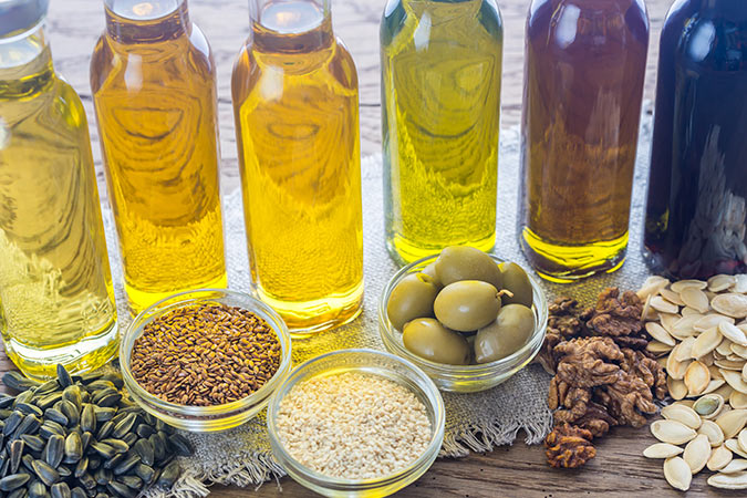 A selection of oils including sunflower seed oil, olive oil and walnut oil