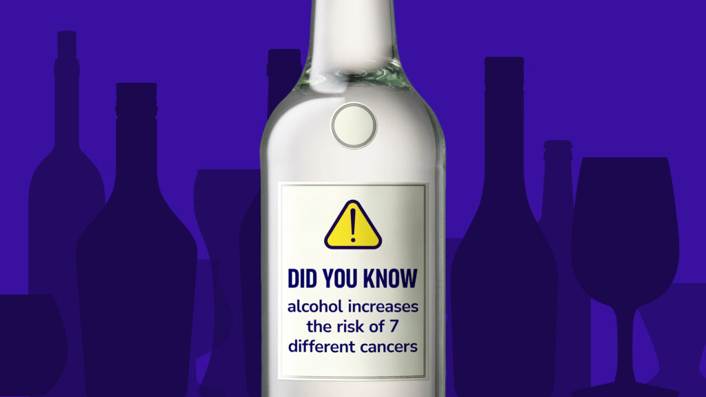 A wine bottle with am image saying 'Did you know alcohol increases the risk of 7 different cancers?'