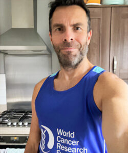 John Steventon in a World Cancer Research Fund running vest