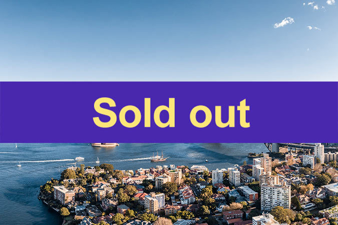 A cityscape near a body of water with boats, overlaid by a bold purple banner featuring the text Sold out in large yellow letters.